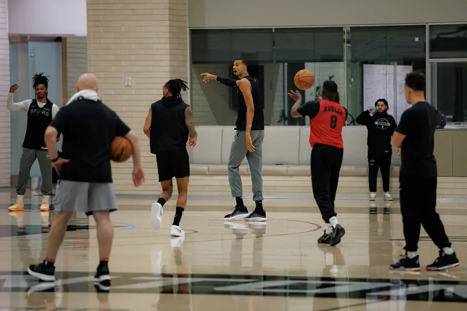 San Antonio Spurs’ Victor Wembanyama, center, participates in a shootaround with his teammates at Victory Capital Performance Center in San Antonio, Tuesday, April 21, 2026. The 22-year-old Frenchman was named NBA Defensive Player of the Year. He is the youngest player to win the award and the first to do so unanimously.
