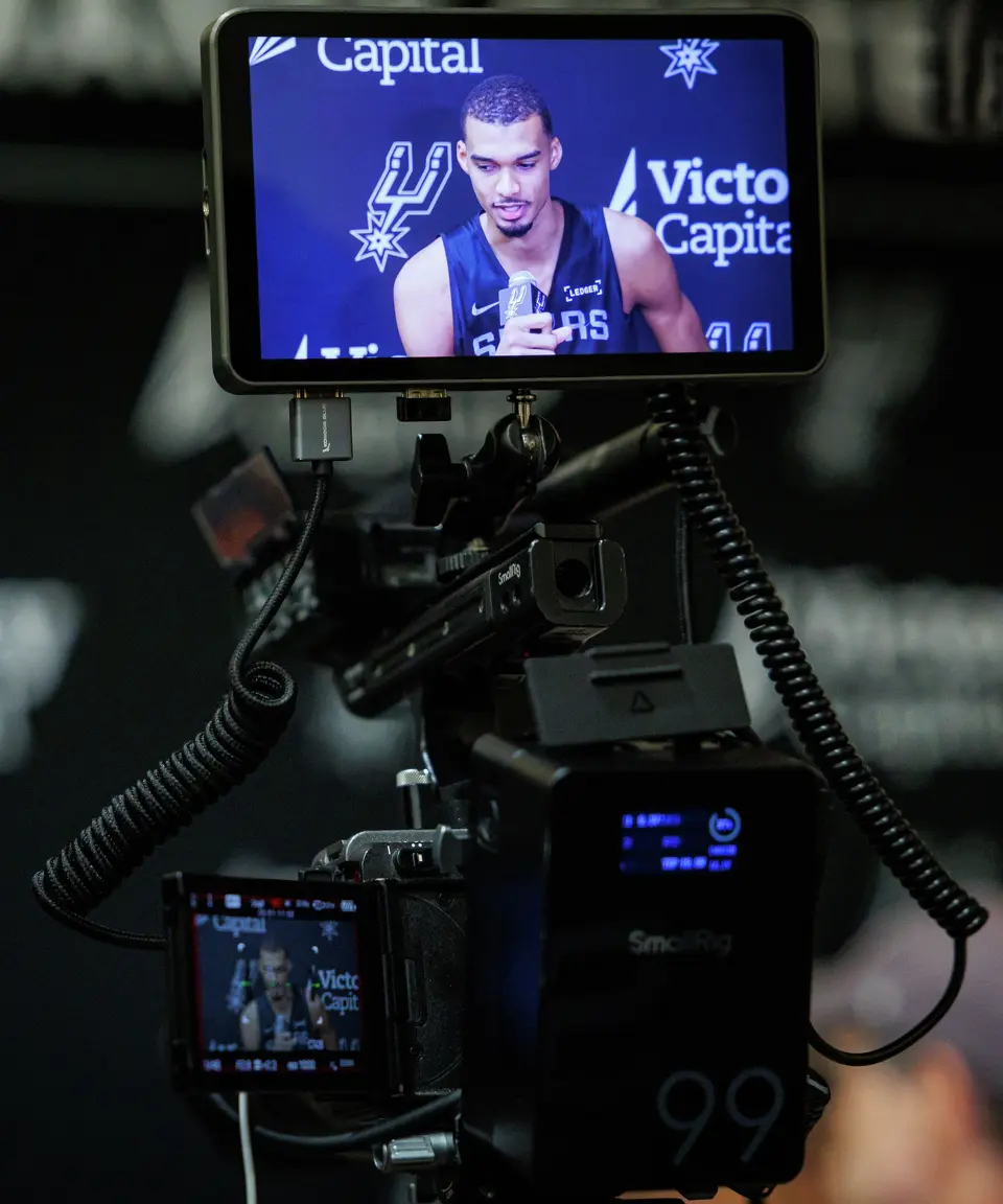 San Antonio Spurs’ Victor Wembanyama talks to reporters about being named NBA Defensive Player of the Year during shoot around practice at Victory Capital Performance Center in San Antonio, Tuesday, April 21, 2026. The 22-year-old Frenchman is the youngest player to win the award and the first to do so unanimously.