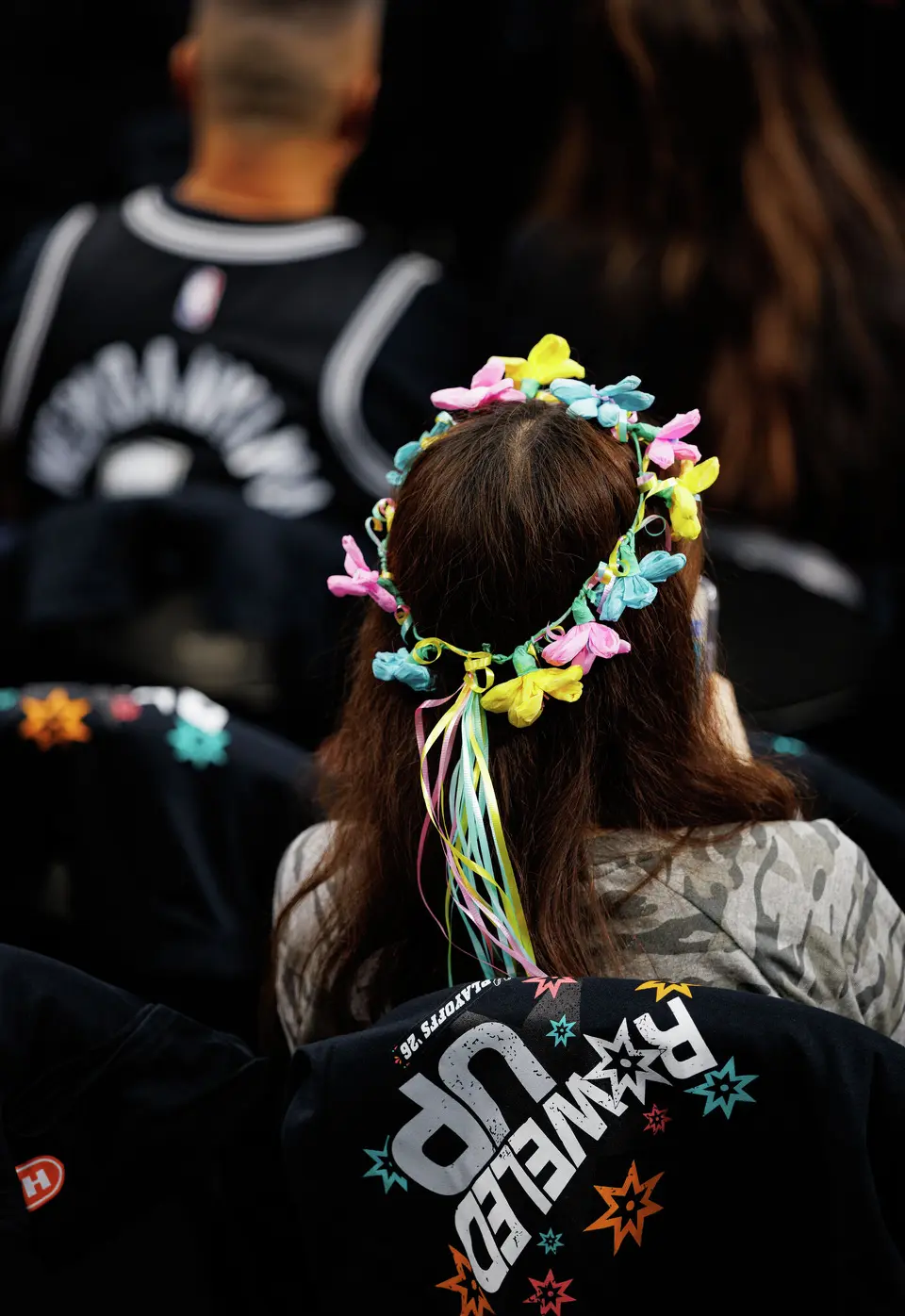 A San Antonio Spurs fan wears a flower crown before game 2 of a first-round NBA playoff series between the San Antonio Spurs and the Portland Trail Blazers at Frost Bank Center in San Antonio, Tuesday, April 21, 2026.