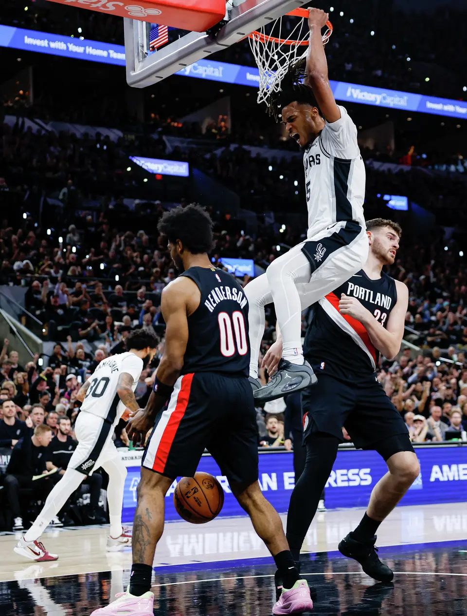 San Antonio Spurs guard Stephon Castle (5) dunks on the Portland Trail Blazers during the first half of Game 2 of a first-round NBA playoff at Frost Bank Center in San Antonio, Tuesday, April 21, 2026.