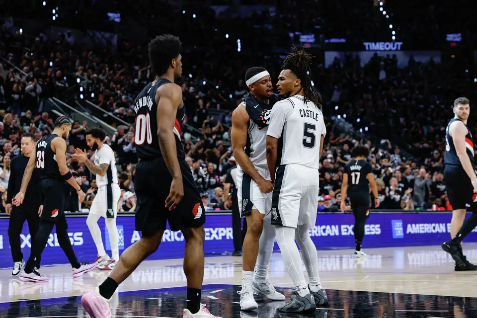 San Antonio Spurs forward Keldon Johnson (3) reacts to San Antonio Spurs guard Stephon Castle’s (5) dunk on the Portland Trail Blazers as they go into a timeout during the first half of Game 2 of a first-round NBA playoff series at Frost Bank Center in San Antonio, Tuesday, April 21, 2026.