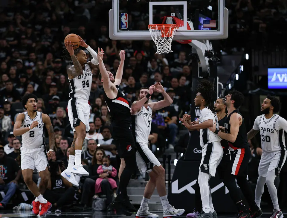 San Antonio Spurs guard Devin Vassell (24) grabs the rebound over the Portland Trail Blazers during the first half of Game 2 of a first-round NBA playoff at Frost Bank Center in San Antonio, Tuesday, April 21, 2026.
