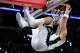 San Antonio Spurs forward Carter Bryant (11) hangs onto the net after dunking on the Portland Trail Blazers during the first half of Game 2 of a first-round NBA playoff series at Frost Bank Center in San Antonio, Tuesday, April 21, 2026.