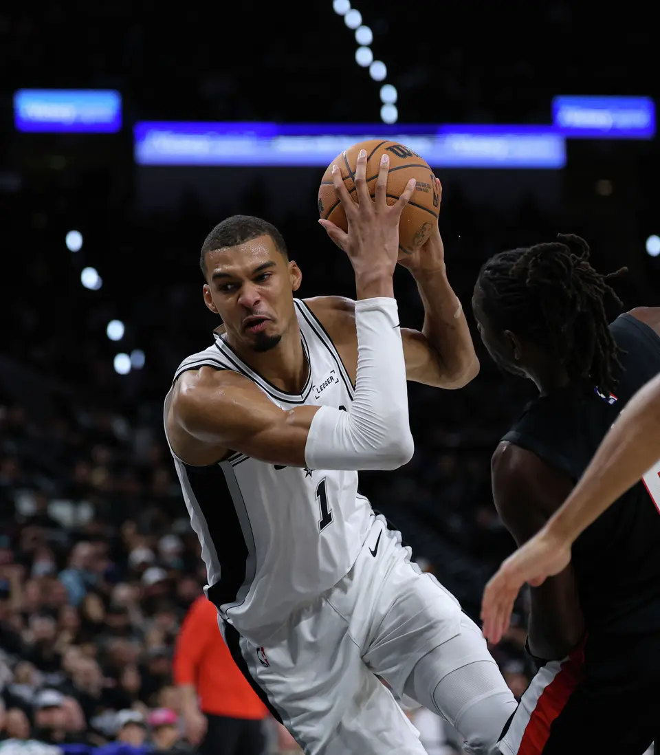 San Antonio Spurs forward Victor Wembanyama (1) trips and falls to the ground while driving to the net during the first half of Game 2 of a first-round NBA playoff series between the San Antonio Spurs and the Portland Trail Blazers at Frost Bank Center in San Antonio, Tuesday, April 21, 2026.