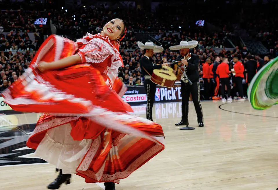 Dancer perform for the crowd during a timeout in Game 2 of a first-round NBA playoff series between the San Antonio Spurs and the Portland Trail Blazers at Frost Bank Center in San Antonio, Tuesday, April 21, 2026. The Spurs fell 106-103, evening the series at 1-1.