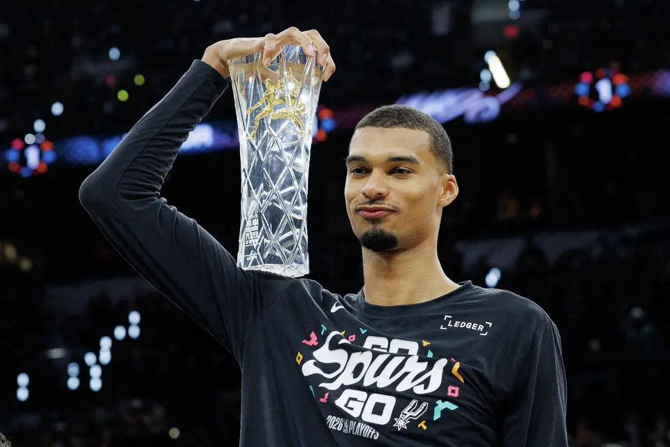 San Antonio Spurs forward Victor Wembanyama holds his NBA Defensive Player of the Year trophy before Game 2 of a first-round NBA playoffs basketball series in San Antonio, Tuesday, April 21, 2026
