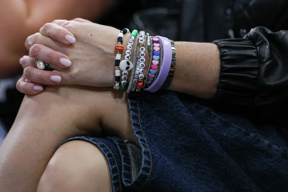 A fan wears San Antonio Spurs-themed friendship bracelets during Game 2 of a first-round NBA playoff series between the Spurs and the Portland Trail Blazers at Frost Bank Center in San Antonio, Tuesday, April 21, 2026.