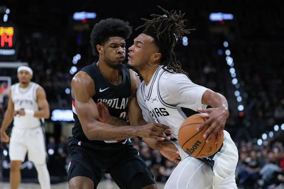Portland Trail Blazers guard Scoot Henderson (00) guards San Antonio Spurs guard Stephon Castle (5) during the first half of Game 2 of a first-round NBA playoff series between the San Antonio Spurs and the Portland Trail Blazers at Frost Bank Center in San Antonio, Tuesday, April 21, 2026. The Spurs fell 106-103, evening the series at 1-1.