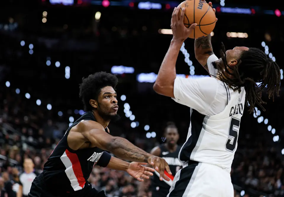 Portland Trail Blazers guard Scoot Henderson (00) guards San Antonio Spurs guard Stephon Castle (5) during the first half of Game 2 of a first-round NBA playoff series at Frost Bank Center in San Antonio, Tuesday, April 21, 2026. The Spurs lost 106-103, tying the series 1-1.