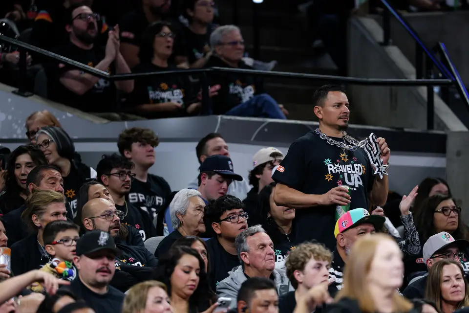 A San Antonio Spurs fan holds up his Spurs chain as he watches the second half of Game 2 of a first-round NBA playoff series against the Portland Trail Blazers at Frost Bank Center in San Antonio, Tuesday, April 21, 2026. The Spurs fell 106-103, evening the series at 1-1.