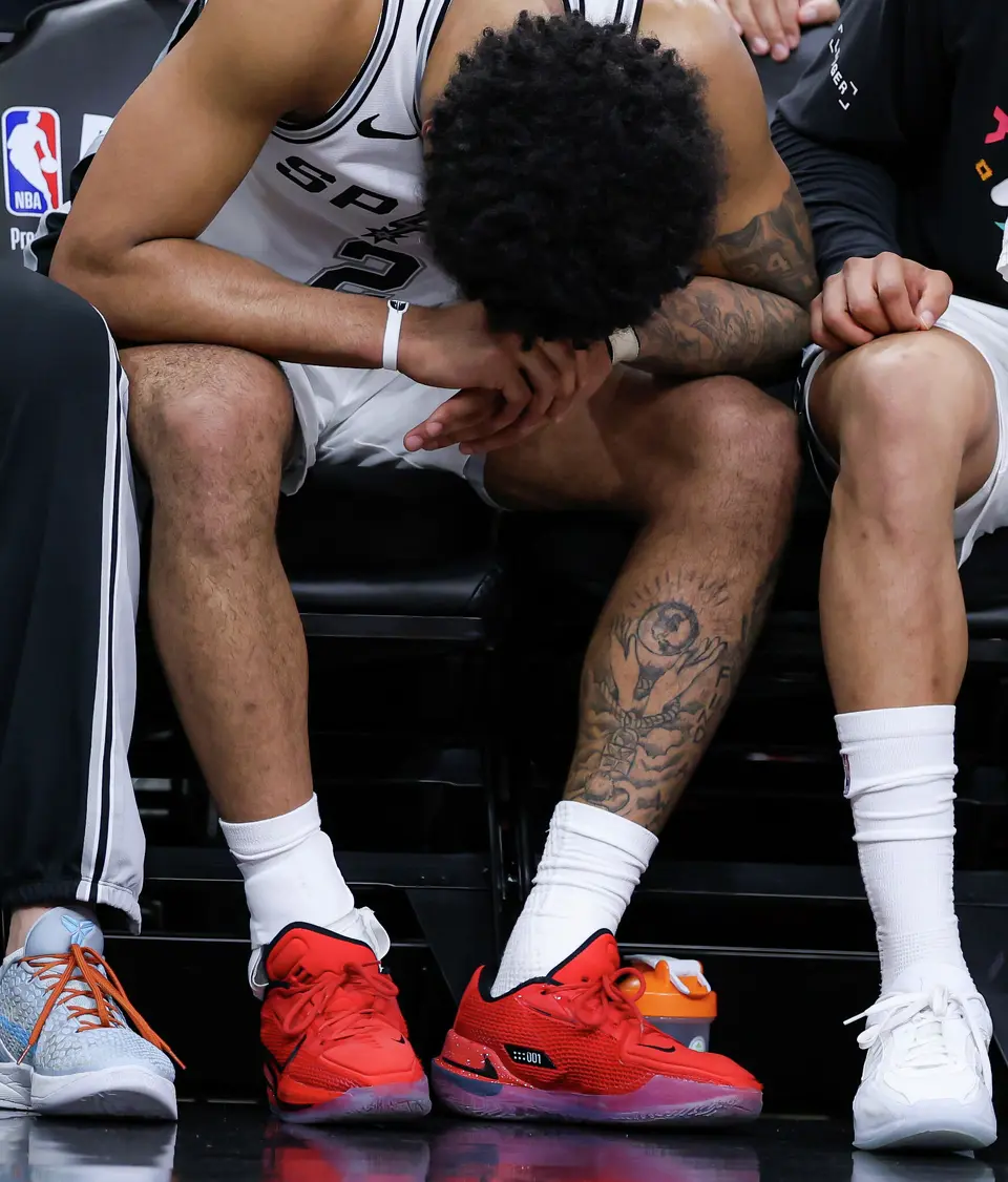 San Antonio Spurs guard Dylan Harper (2) reacts while holding his injured hand during the second half of Game 2 of a first-round NBA playoff series at Frost Bank Center in San Antonio, Tuesday, April 21, 2026. The Spurs fell 106-103, evening the series at 1-1.