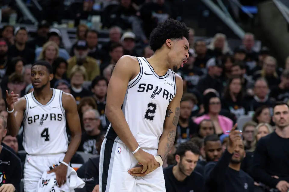 San Antonio Spurs guard Dylan Harper (2) reacts while holding his injured hand during the second half of Game 2 of a first-round NBA playoff series at Frost Bank Center in San Antonio, Tuesday, April 21, 2026. The Spurs fell 106-103, evening the series at 1-1.