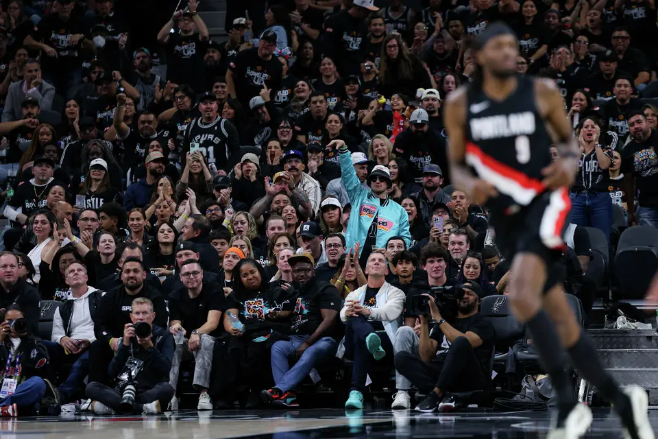 San Antonio Spurs fans cheer as San Antonio Spurs guard Devin Vassell (24) makes a 3-pointer during the second half of Game 2 of a first-round NBA playoff series at Frost Bank Center in San Antonio, Tuesday, April 21, 2026. The Spurs fell 106-103, evening the series at 1-1.