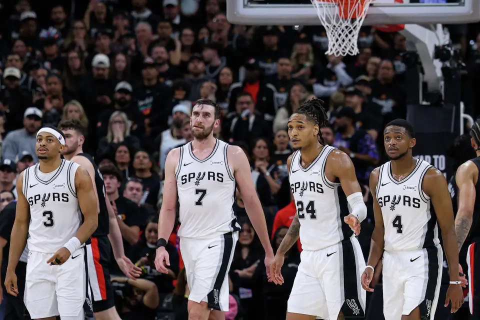 San Antonio Spurs forward Keldon Johnson (3), center Luke Kornet (7), guard Devin Vassell (24) and guard De'aaron Fox (4) walk off the court for a timeout during the fourth quarter of Game 2 of a first-round NBA playoff series against the Portland Trail Blazers at Frost Bank Center in San Antonio, Tuesday, April 21, 2026. The Spurs fell 106-103, evening the series at 1-1.