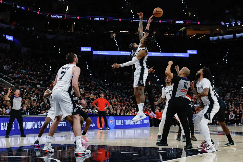 Portland Trail Blazers forward Toumani Camara (33) wins the jump ball over San Antonio Spurs guard Devin Vassell (24) during the second half of Game 2 of a first-round NBA playoff series at Frost Bank Center in San Antonio, Tuesday, April 21, 2026. The Spurs fell 106-103, evening the series at 1-1.
