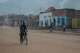 FILE - A man rides a bicycle on a street as people return to their homes in Uvira, Democratic Republic of Congo, Dec. 13, 2025.