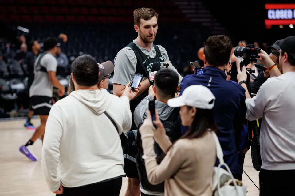 San Antonio Spurs center Luke Kornet (7) answers questions from reporters during shootaround at the Moda Center in Portland, Ore., Friday, April 24, 2026, as the Spurs prepare for Game 3 against the Portland Trail Blazers.