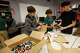 Robert T. Hill Middle School seventh grader Jackson Lee (from left) makes artwork with classmates Irving Valencia and Gabriel Huffman during a Reading Language Arts class on April 24, 2026, in Dallas. Leaders at Robert. T. Hill created the makerspace after a campus-wide cellphone ban went into effect as a way of giving students more opportunities for interaction.