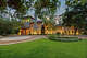 A circular driveway leads to the Mediterranean mansion, clad in stone, brick and tile imported from Europe.