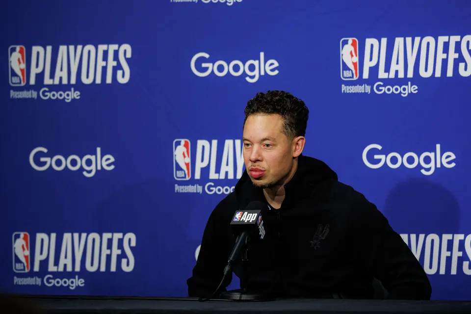 San Antonio Spurs head coach Mitch Johnson answers questions from reporters at a pre-game press conference before Game 3 of a first-round NBA playoff series against the Portland Trail Blazers at Moda Center in Portland, Friday, April 24, 2026.