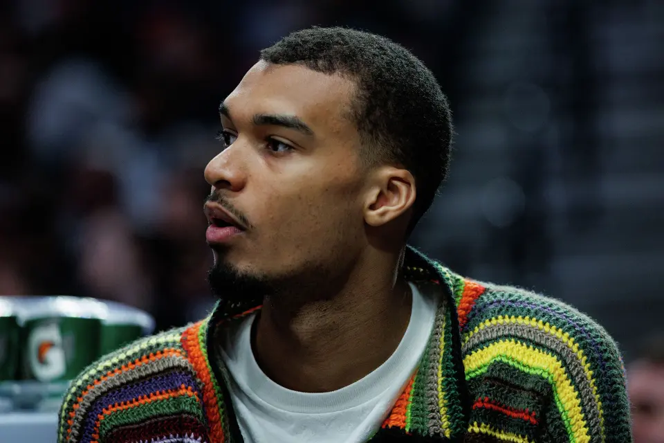 San Antonio Spurs forward Victor Wembanyama (1) watches his teammates play during the first quarter of Game 3 of a first-round NBA playoff series against the Portland Trail Blazers at Moda Center in Portland, Friday, April 24, 2026.
