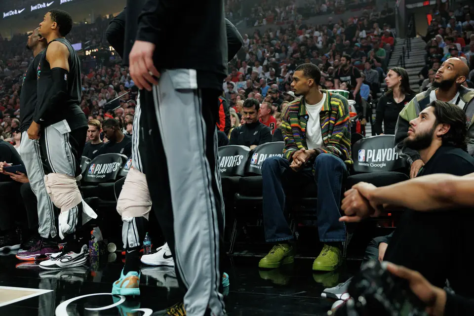 San Antonio Spurs forward Victor Wembanyama (1) sits on the bench during the first quarter of Game 3 of a first-round NBA playoff series against the Portland Trail Blazers at Moda Center in Portland, Friday, April 24, 2026.