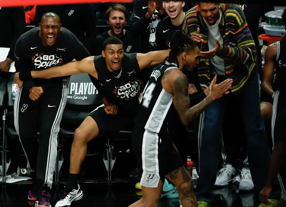 The San Antonio Spurs bench goes wild as a Portland Trail Blazers ball goes out of bounds during the fourth quarter of Game 3 of a first-round NBA playoff series at Moda Center in Portland, Saturday, April 25, 2026. The Spurs defeated the Trail Blazers 120-108 to lead the series 2-1.