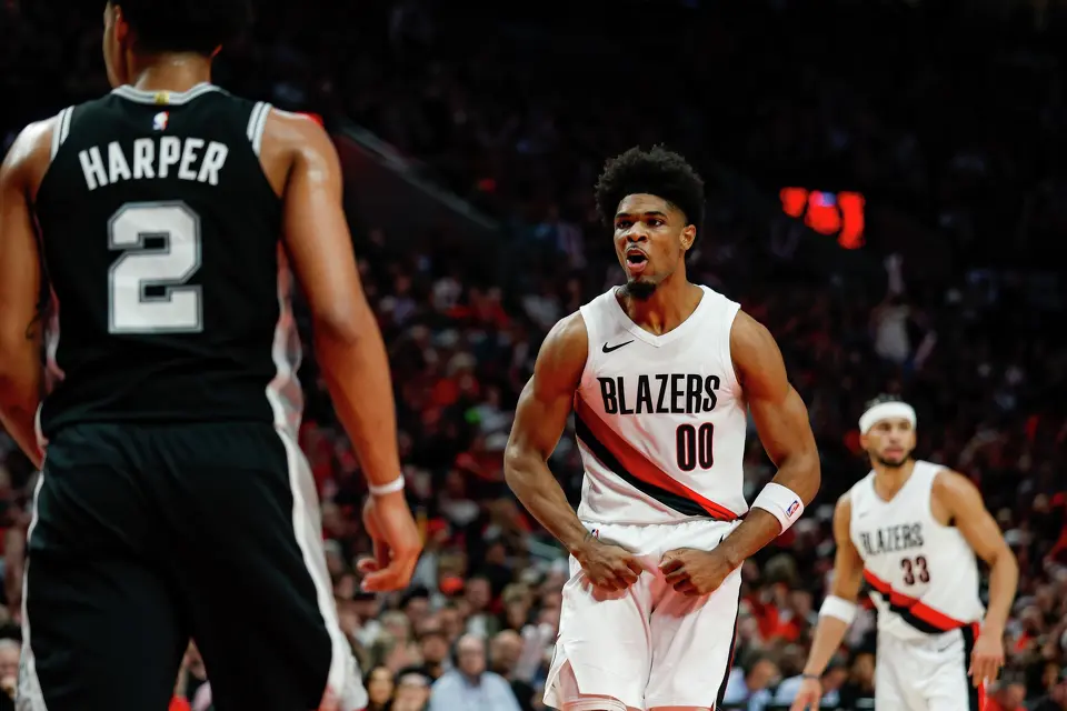 Portland Trail Blazers guard Scoot Henderson (00) chirps at San Antonio Spurs guard Dylan Harper (2) which lead to a technical foul during the third quarter of Game 3 of a first-round NBA playoff series at Moda Center in Portland, Friday, April 24, 2026. The Spurs defeated the Trail Blazers 120-108 to lead the series 2-1.