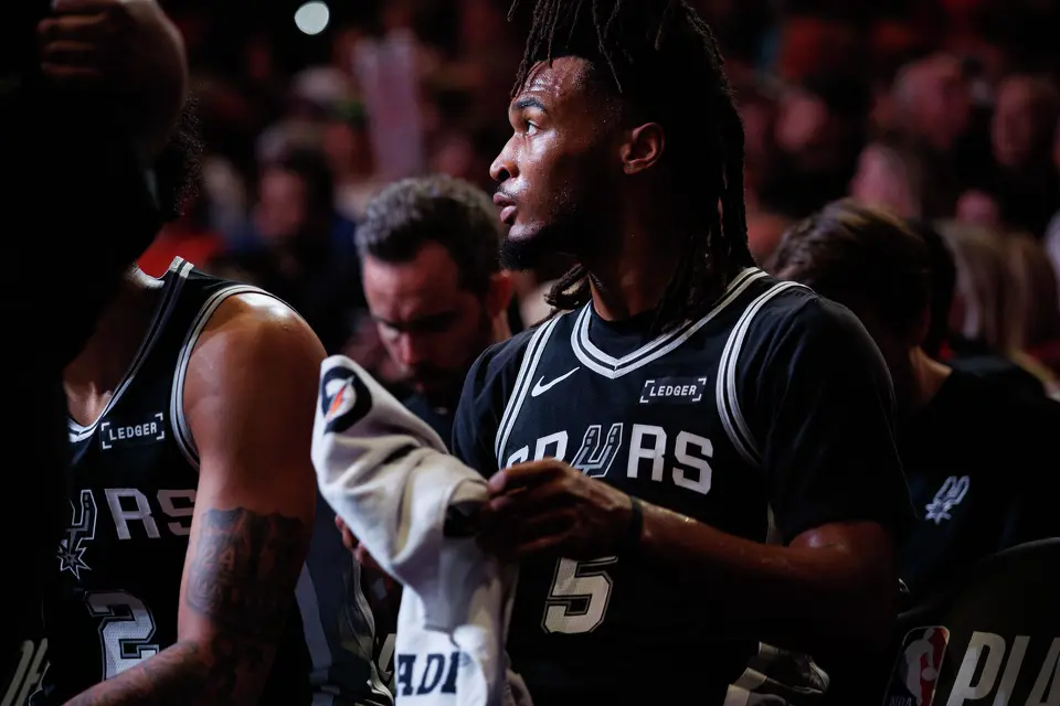 San Antonio Spurs guard Stephon Castle (5) sits on the bench during a timeout in the first quarter of Game 3 of a first-round NBA playoff series against the Portland Trail Blazers at Moda Center in Portland, Friday, April 24, 2026.