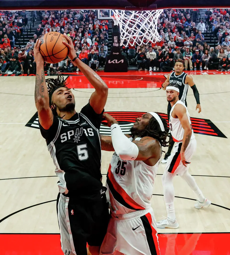 San Antonio Spurs guard Stephon Castle (5) goes up for a shot over Portland Trail Blazers center Robert Williams III (35) during Game 3 of a first-round NBA playoff series at Moda Center in Portland, Friday, April 24, 2026. Castle had 33 points, two rebounds and 5 assists, which helped lead the Spurs to a 120-108 victory.