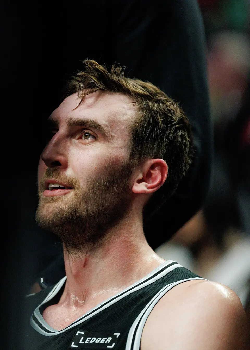 San Antonio Spurs center Luke Kornet (7) sits on the bench during a second quarter timeout in Game 3 of a first-round NBA playoff series against the Portland Trail Blazers at Moda Center in Portland, Friday, April 24, 2026.