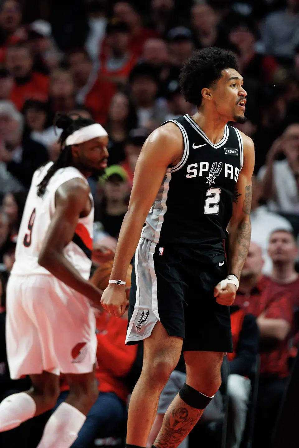 San Antonio Spurs guard Dylan Harper (2) reacts after making a basket during the third quarter of Game 3 of a first-round NBA playoff series against the Portland Trail Blazers at Moda Center in Portland, Friday, April 24, 2026. The Spurs defeated the Trail Blazers 120-108 to lead the series 2-1.