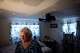 Diane Shields turns on a lamp in her bedroom in Fort Worth, March 25, 2026. The roof is sagging which caused the ceiling to cave in she said. Repairs were made but the roof is still compromised causing it to leak and ceiling tiles to fall when it rains.