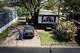 Diane Shields stands in her driveway and looks down her block in Fort Worth, March 25, 2026. When Shields retired 12 years ago, she spent much of her retirement savings on fixing up her trailer home and Kia sedan hoping she would not outlive the repairs, she said.