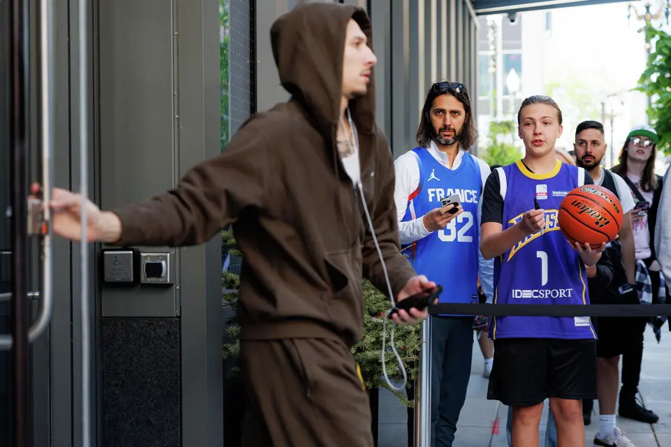 San Antonio Spurs fans ask San Antonio Spurs forward Lindy Waters III for an autograph as he walks out of the team hotel on an off day during a first-round NBA playoff series against the Portland Trail Blazers, Saturday, April 25, 2026, in Portland, Ore. The Spurs face the Trail Blazers in Game 4 on Sunday afternoon.