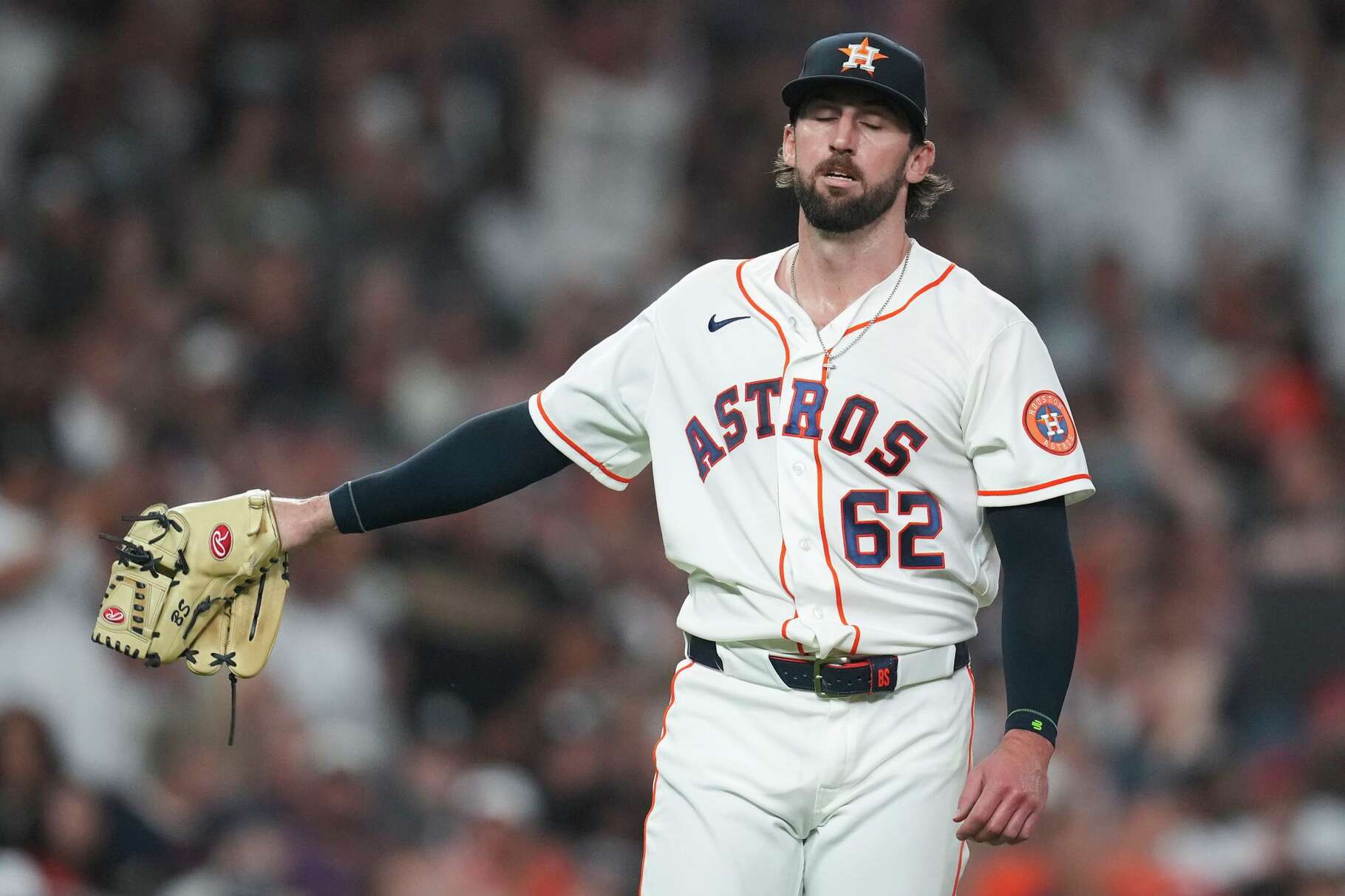 Houston Astros pitcher Bennett Sousa reacts after walking his second batter with the bases loaded during the seventh inning of an MLB baseball game at Daikin Park, Saturday, April 25, 2026, in Houston.