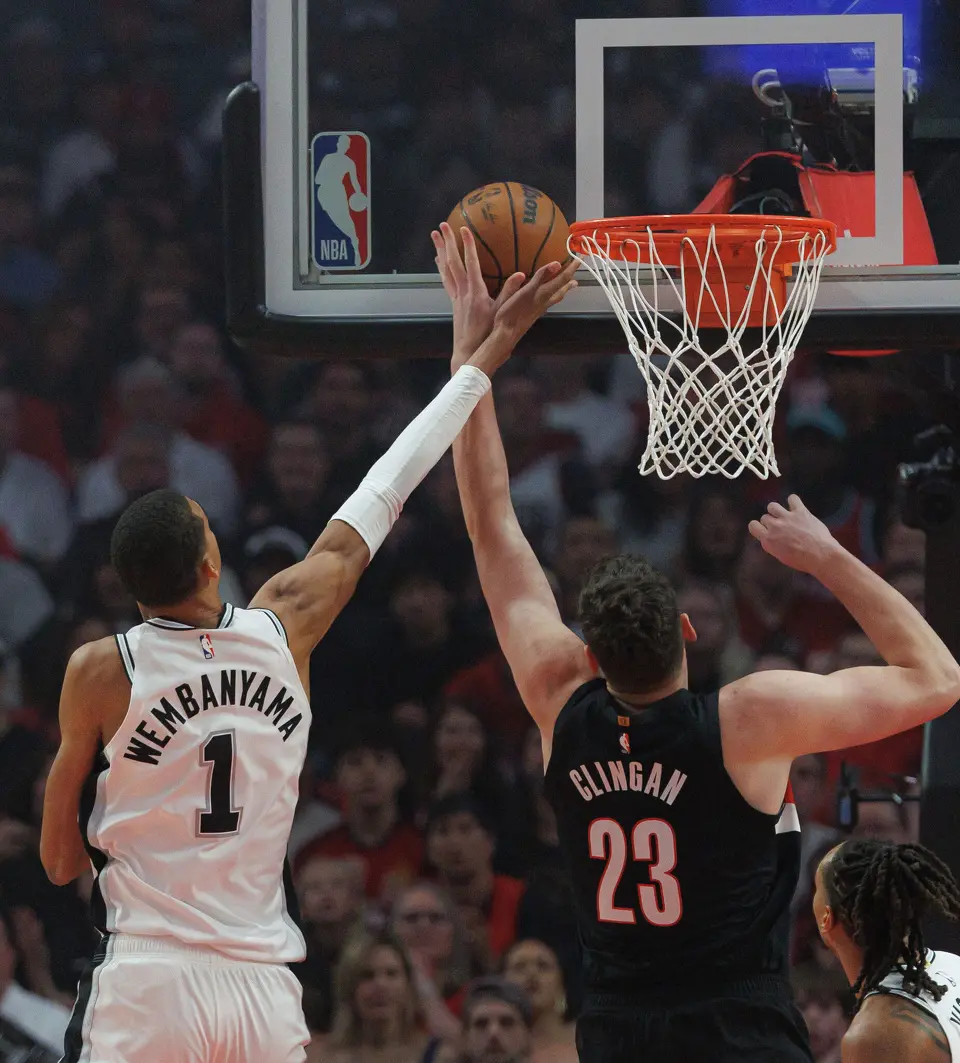 San Antonio Spurs forward Victor Wembanyama (1) blocks a shot by Portland Trail Blazers center Donovan Clingan (23) at the basket during the first quarter of Game 4 of a first-round NBA playoff series at Moda Center on Sunday, April 26, 2026.
