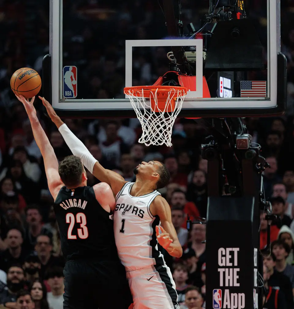 San Antonio Spurs forward Victor Wembanyama (1) blocks a shot from Portland Trail Blazers center Donovan Clingan (23) during the first quarter of Game 4 of a first-round NBA playoff series at Moda Center on Sunday, April 26, 2026.