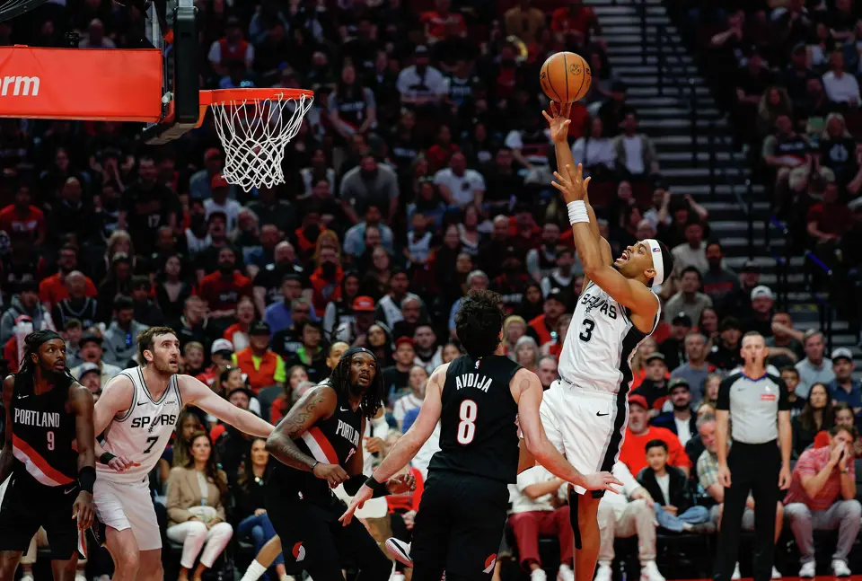 San Antonio Spurs forward Keldon Johnson (3) goes up for a shot during the second quarter of Game 4 of a first-round NBA playoff series against the Portland Trail Blazers at Moda Center on Sunday, April 26, 2026.