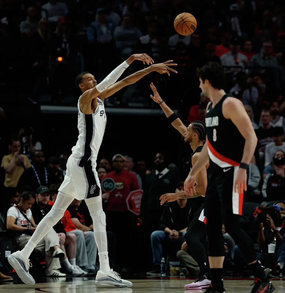 San Antonio Spurs forward Victor Wembanyama (1) makes a pass over Portland Trail Blazers forward Toumani Camara (33) during the third quarter of Game 4 of a first-round NBA playoff series at Moda Center on Sunday, April 26, 2026.