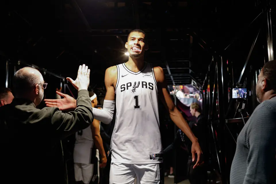 San Antonio Spurs forward Victor Wembanyama (1) slaps hands with people as he walks back to the locker room following a post-game interview after Game 4 of a first-round NBA playoff series against the Portland Trail Blazers at Moda Center on Sunday, April 26, 2026. The Spurs won 114-93, leading the series 3-1.