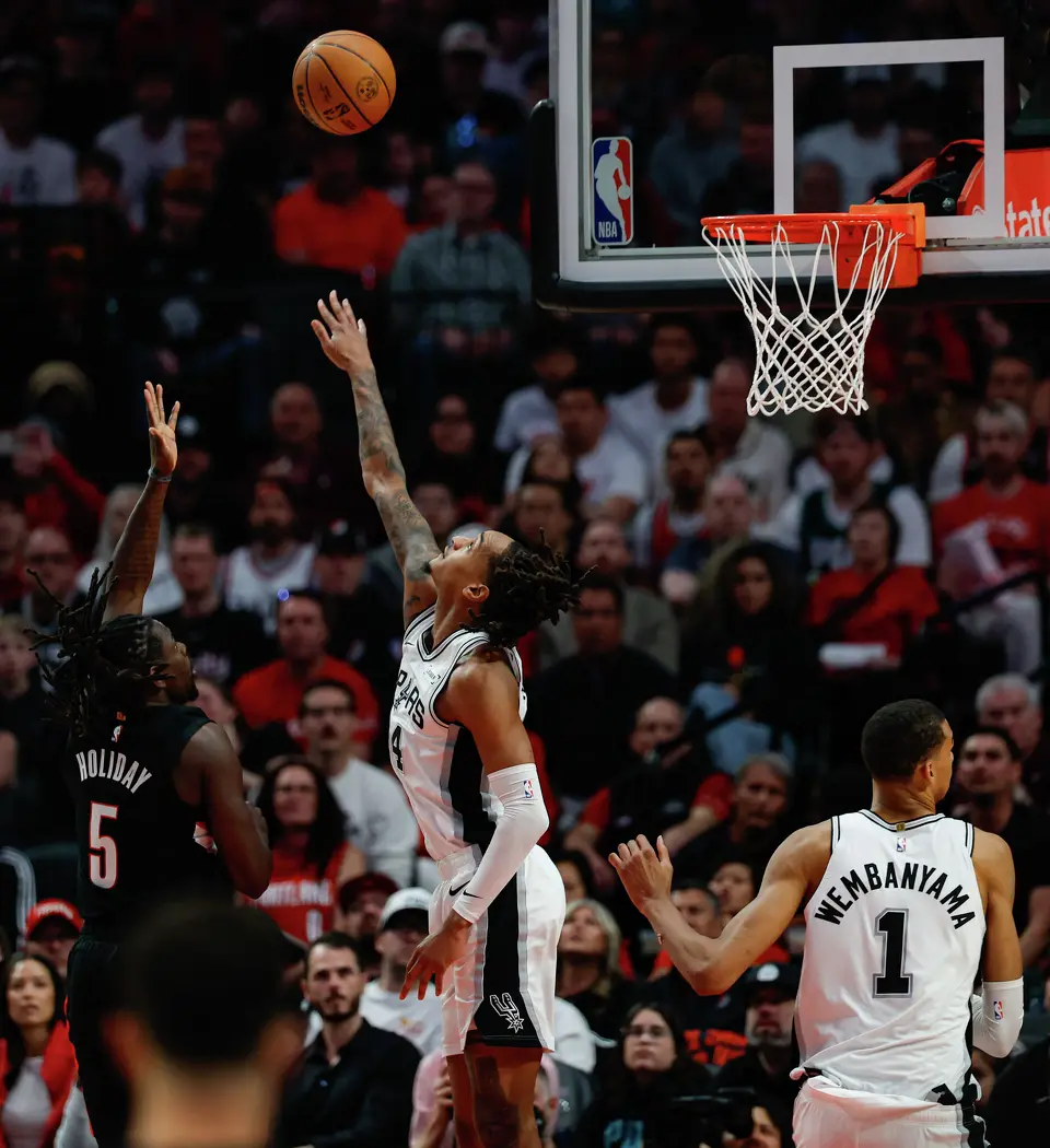 San Antonio Spurs guard Devin Vassell (24) guards Portland Trail Blazers guard Jrue Holiday (5) during the second quarter of Game 4 of a first-round NBA playoff series at Moda Center on Sunday, April 26, 2026.
