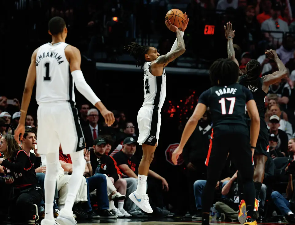San Antonio Spurs guard Devin Vassell (24) goes up for a shot during the third quarter of Game 4 of a first-round NBA playoff series against the Portland Trail Blazers at Moda Center on Sunday, April 26, 2026.