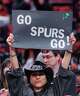 Diane Sanchez, who lives in Washington and grew up in the Rio Grande Valley, holds up a “Go Spurs Go” sign as she attends Game 4 of a first-round NBA playoff series between the San Antonio Spurs and the Portland Trail Blazers on April 26 at the Moda Center.