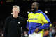 Draymond Green of the Golden State Warriors stands with head coach Steve Kerr during the second half of an NBA play-in tournament game at Mortgage Matchup Center on April 17, 2026 in Phoenix. The Suns defeated the Warriors 111-96.