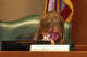 Committee Clerk Haylee Plumley wipes her eyes while listening to testimony during a joint House and Senate flood investigating committee hearing at the Texas Capitol on Monday, April 27, 2026.