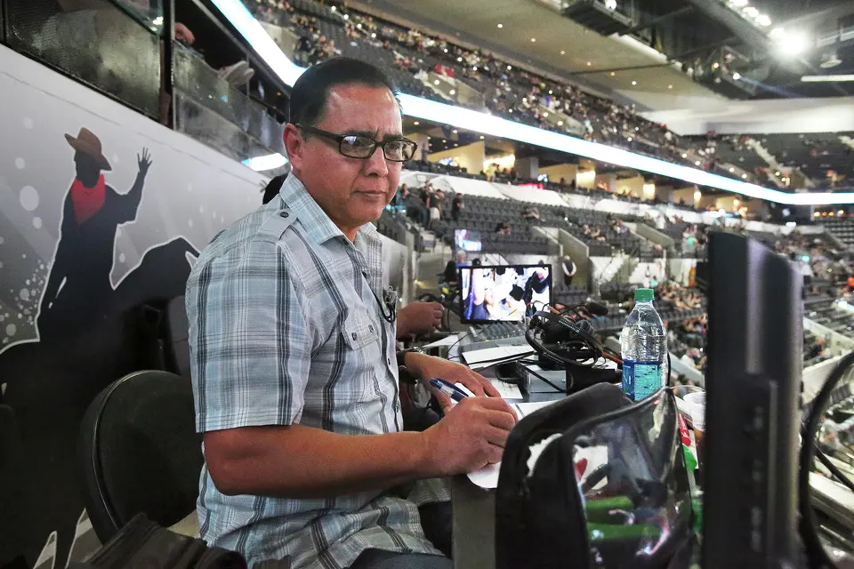Paul Castro, spanish language broadcaster, mans his station as the newly renovated AT&T Center opens on October 18, 2015.