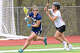 Simbury's Olivia Petron (18) runs around Masuk's Abby Troesser (25) during their game Saturday, April 25, 2026 at Masuk High School.