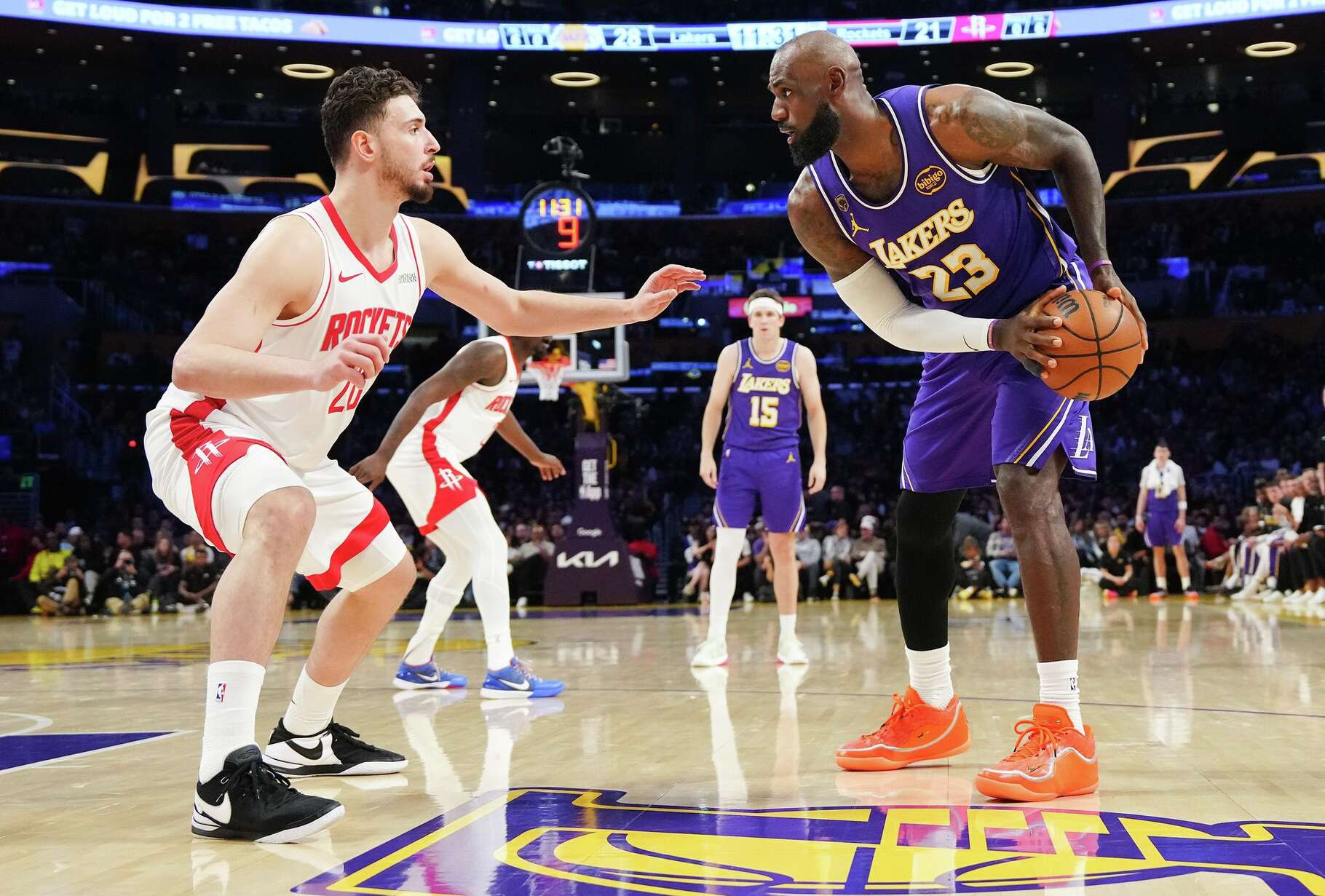 Los Angeles Lakers forward LeBron James (23) posts up against Houston Rockets center Alperen Sengun (28) during Game 5 of a first-round NBA playoff basketball series at Cyrpto.com Arena in Los Angeles on Wednesday, April 29, 2026.