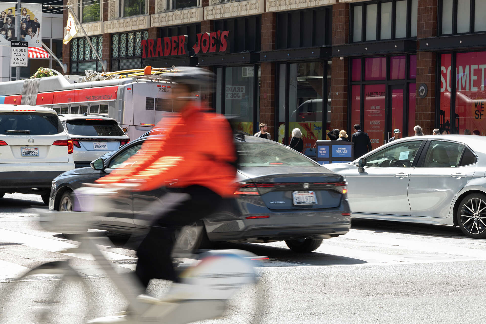 A biker going down Market Street in San Francisco on April 30, 2026.